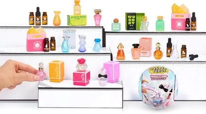 Mini fragrance display kit with shelves of small bottles in pink, green, and orange
