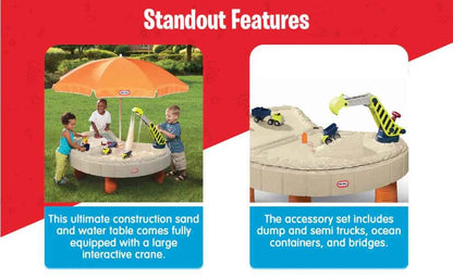 Construction sand and water table with orange umbrella and toy trucks in tub