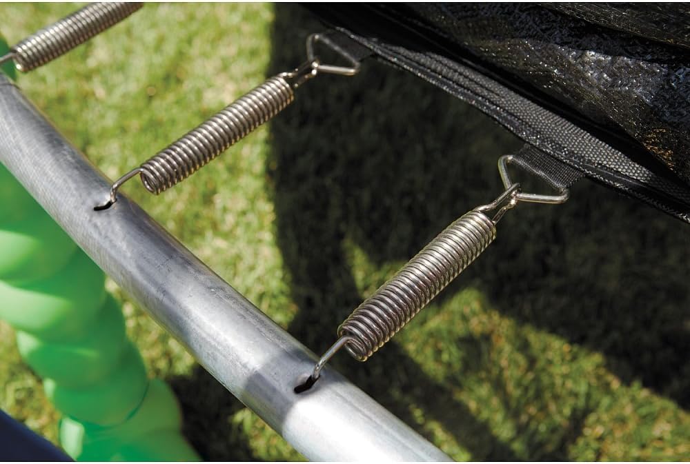 Metal trampoline frame with coiled springs and black safety net attachment