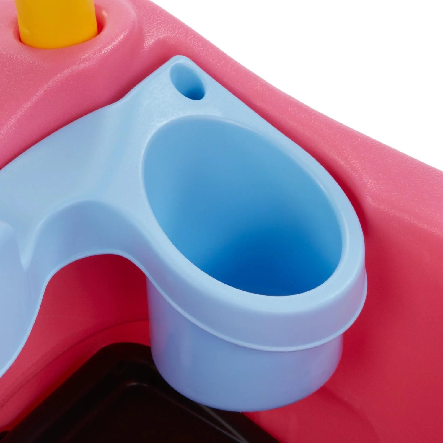 Blue cup holder on pink-and light-blue carriage panel
