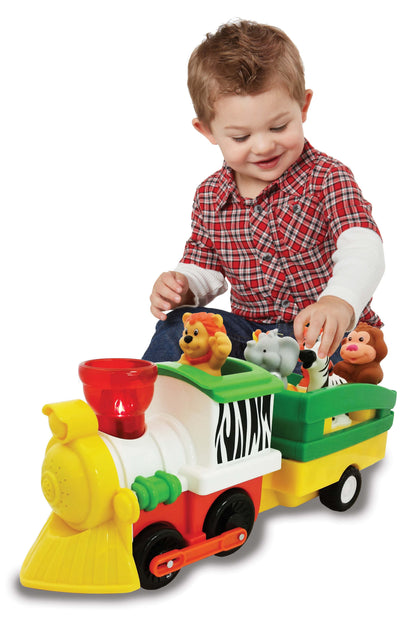 Toy steam locomotive with animal figures, being played with by a child.