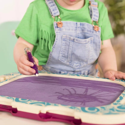 Purple water doodle drawing board close-up with water pen and child's hands