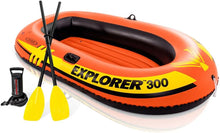 Orange inflatable boat with black interior, includes two oars and hand pump