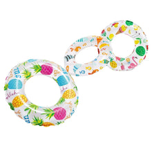 Inflatable beach ring set: pineapple and sea-animal multicolor prints.