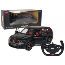 Black 1:14 scale RC car model with red accents, plus BMW steering-wheel controller