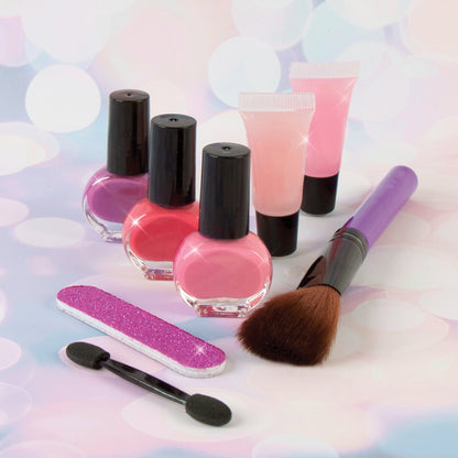 Glam makeup set bottles with pink and purple polish, mini brush and glitter file