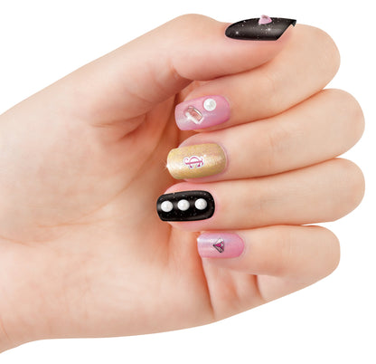 Nail art manicure on fingers: pink, gold glitter, and black with 3D gems