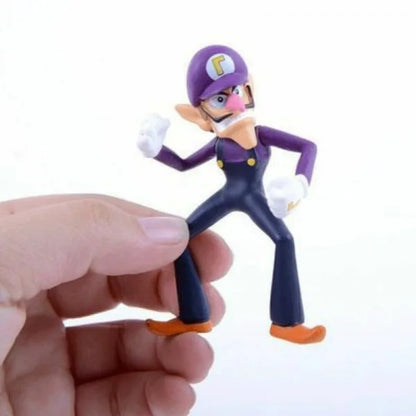 Purple-capped action figure with purple hat and blue jumpsuit, orange shoes