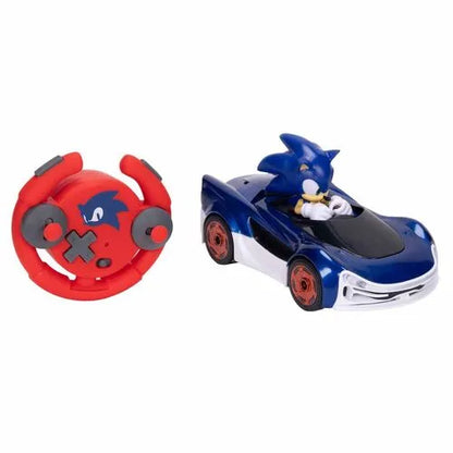 Blue RC drifting car with black hood, plus red controller wheel with button grips