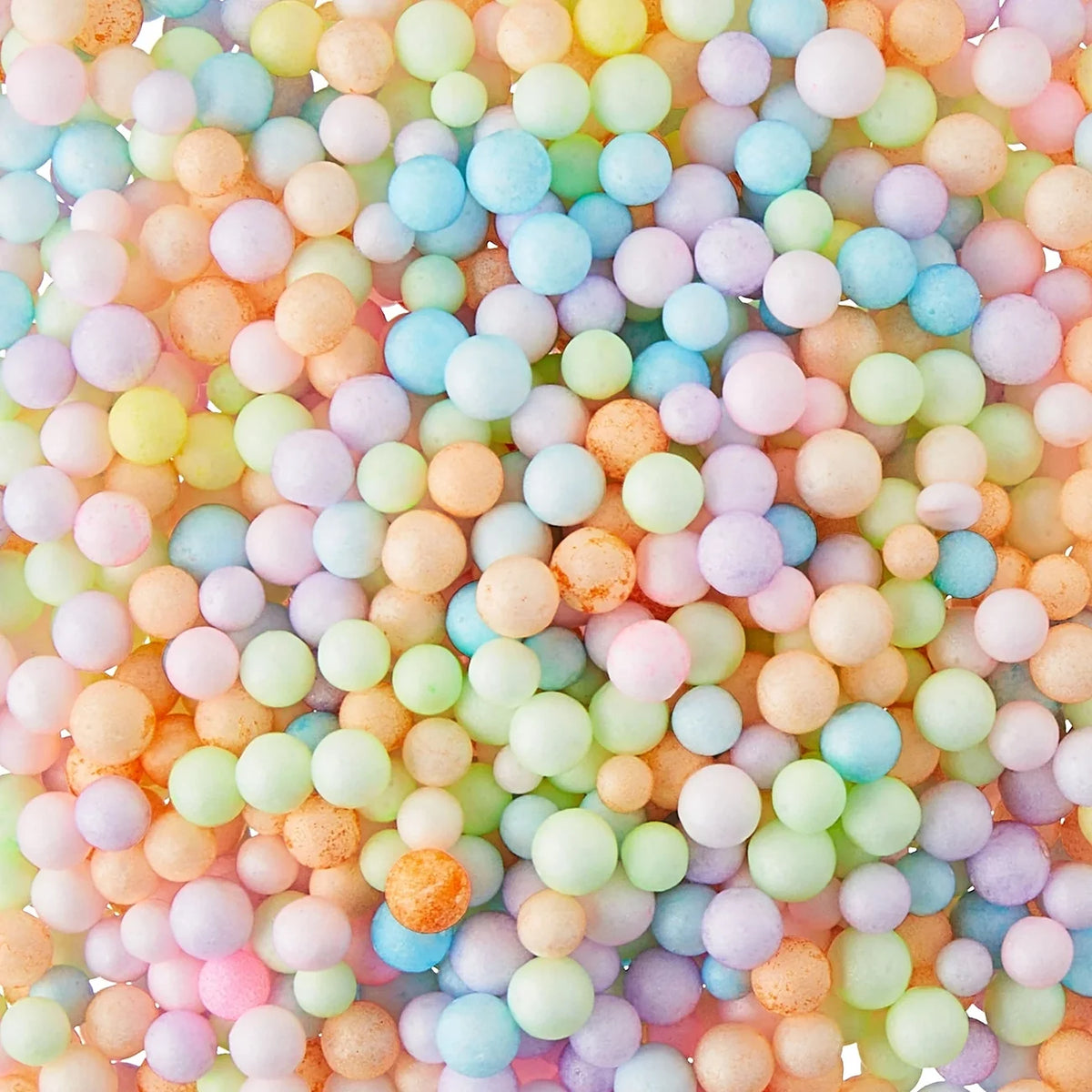 Assorted pastel air-dry clay balls in mixed colors with speckled texture