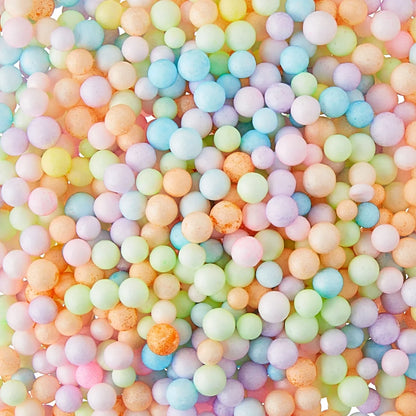 Assorted pastel air-dry clay balls in mixed colors with speckled texture