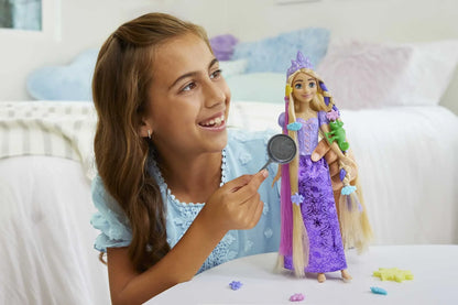 Purple fashion doll with tiara, long violet gown, and color-change hair extensions
