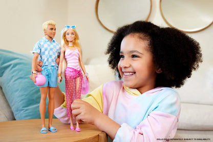 Fashion doll set: boy in blue check shirt and shorts, girl in pink striped swimsuit dress