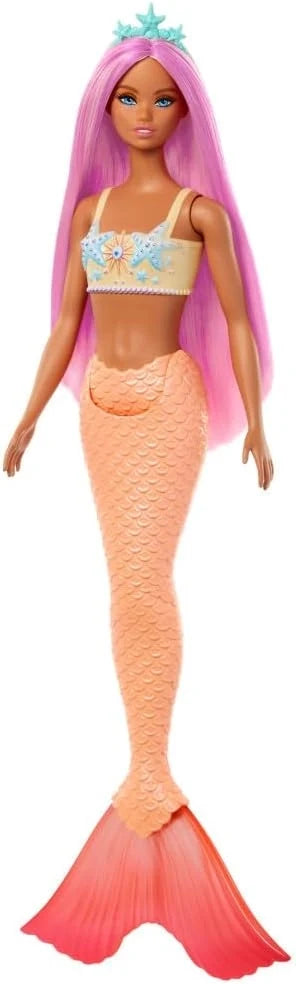 Barbie mermaid doll in pale peach top and orange mermaid tail, long purple hair