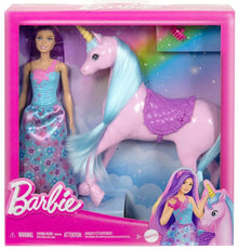 Barbie fashion doll in blue floral dress with pink unicorn figure, retail box