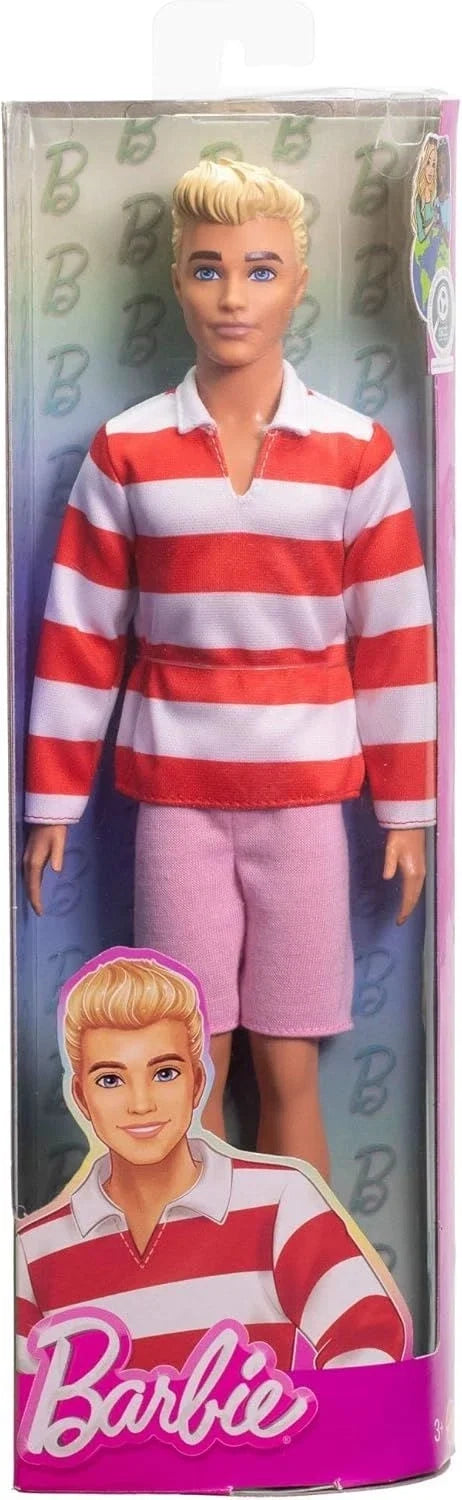 Boxed doll wearing red-and-white striped polo shirt and pink shorts