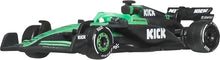 Green and black race car toy side view with black rear wing and front splitter