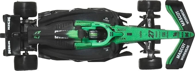 Green and black race car toy viewed from above with visible wheels and chassis