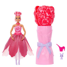 Pink fashion doll with rose bodice, striped skirt, and pink accessory cup