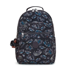 Large backpack with dark navy jungle-and-vehicle pattern, front zip pocket, top handle