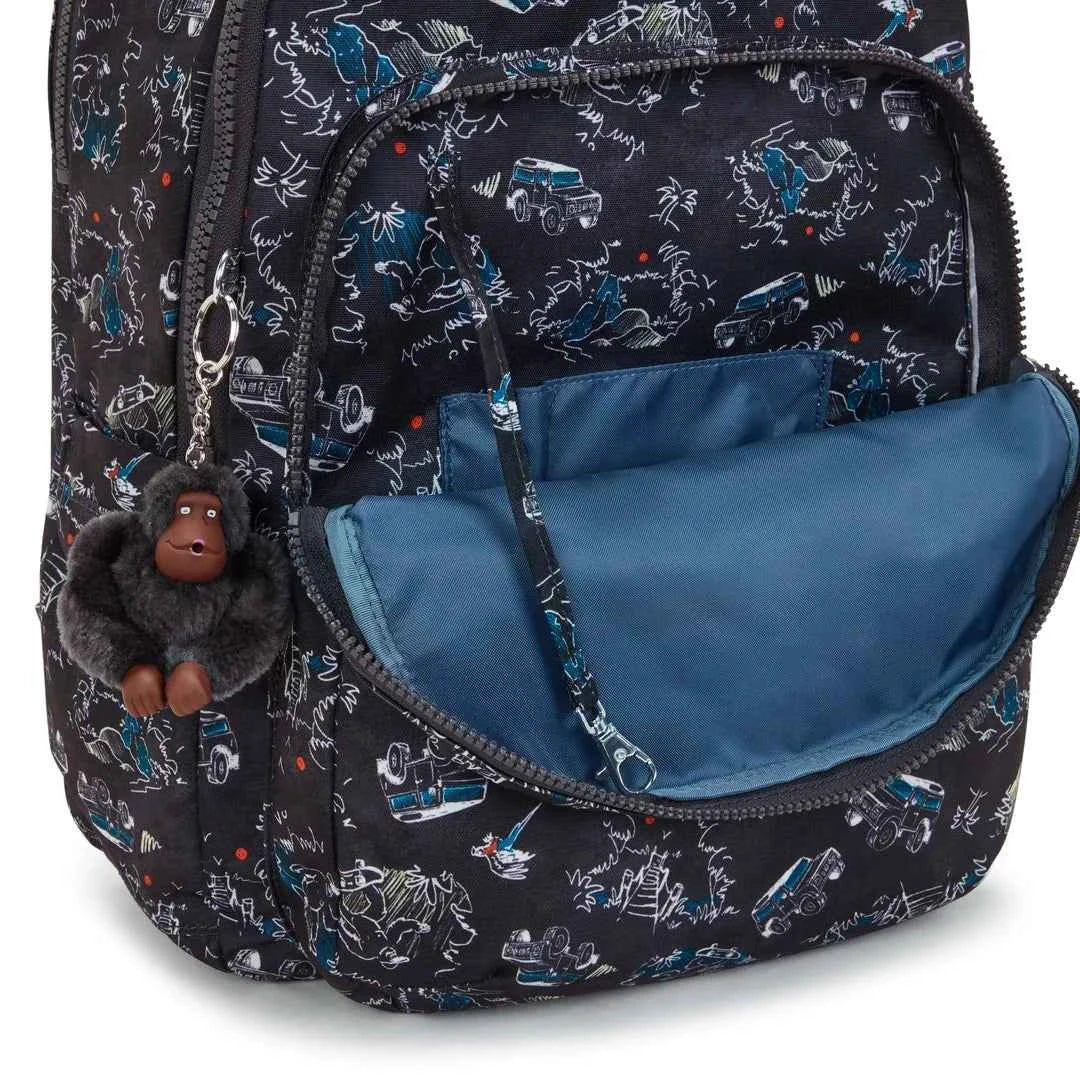 Black patterned backpack interior with blue zip pocket and small compartments; plush charm.