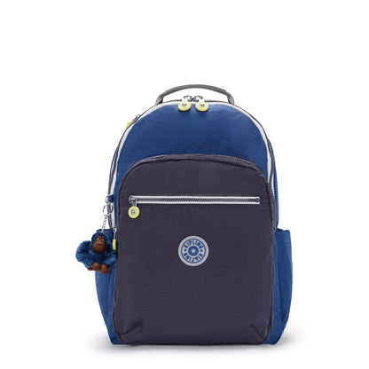 Large blue backpack with front zip pocket, logo patch, and hanging charm keychain