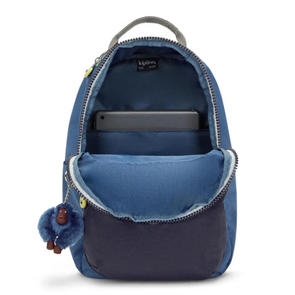 Blue small backpack with open top showing inner pocket and zipper closure