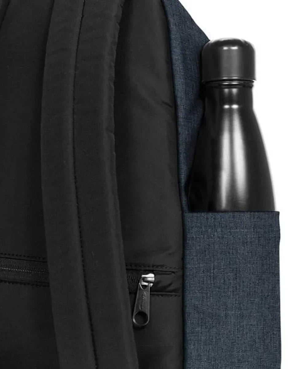 Black backpack with bottle in denim side pocket and visible zipper pull
