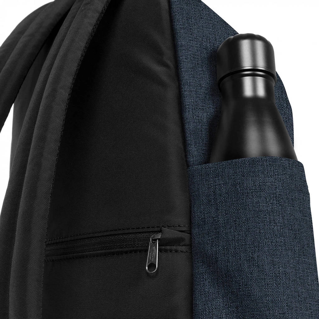 Dark blue backpack side pocket with zipper and bottle sleeve