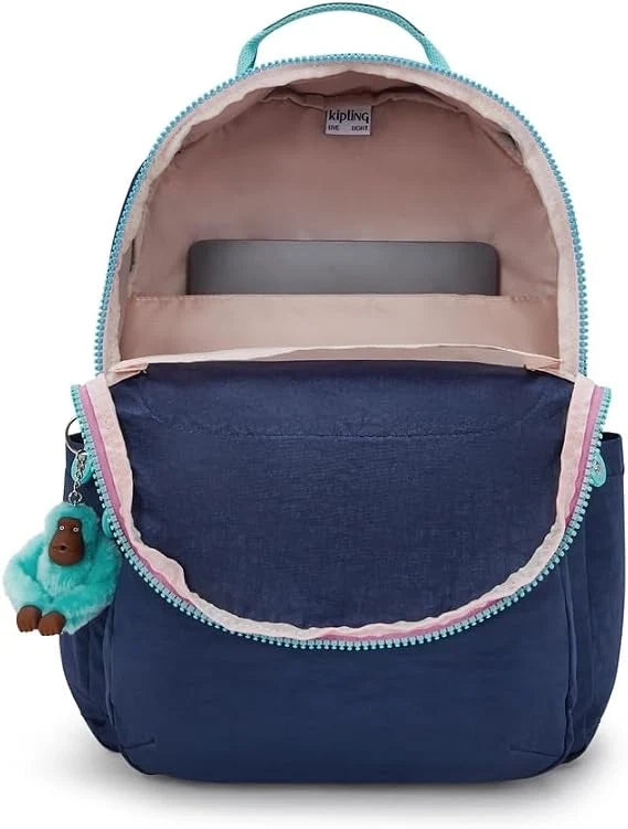 Kipling Seoul navy backpack open top showing beige interior with padded divider and zip pocket