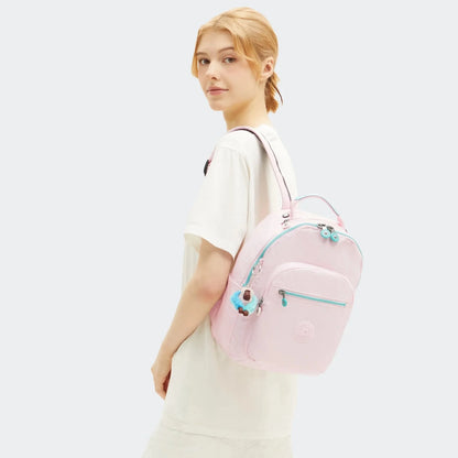 Kipling Seoul mini backpack in sea pink metallic with turquoise trim and front zip pocket