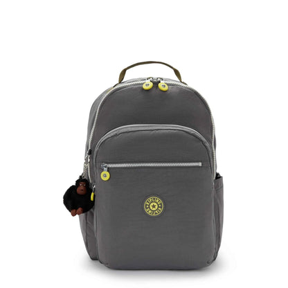 Dark gray mini backpack with top handle, front zip pocket, and circular logo patch