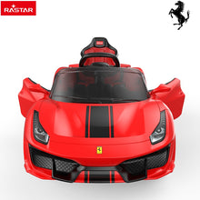 Red ride-on sports car front with black windshield and steering wheel