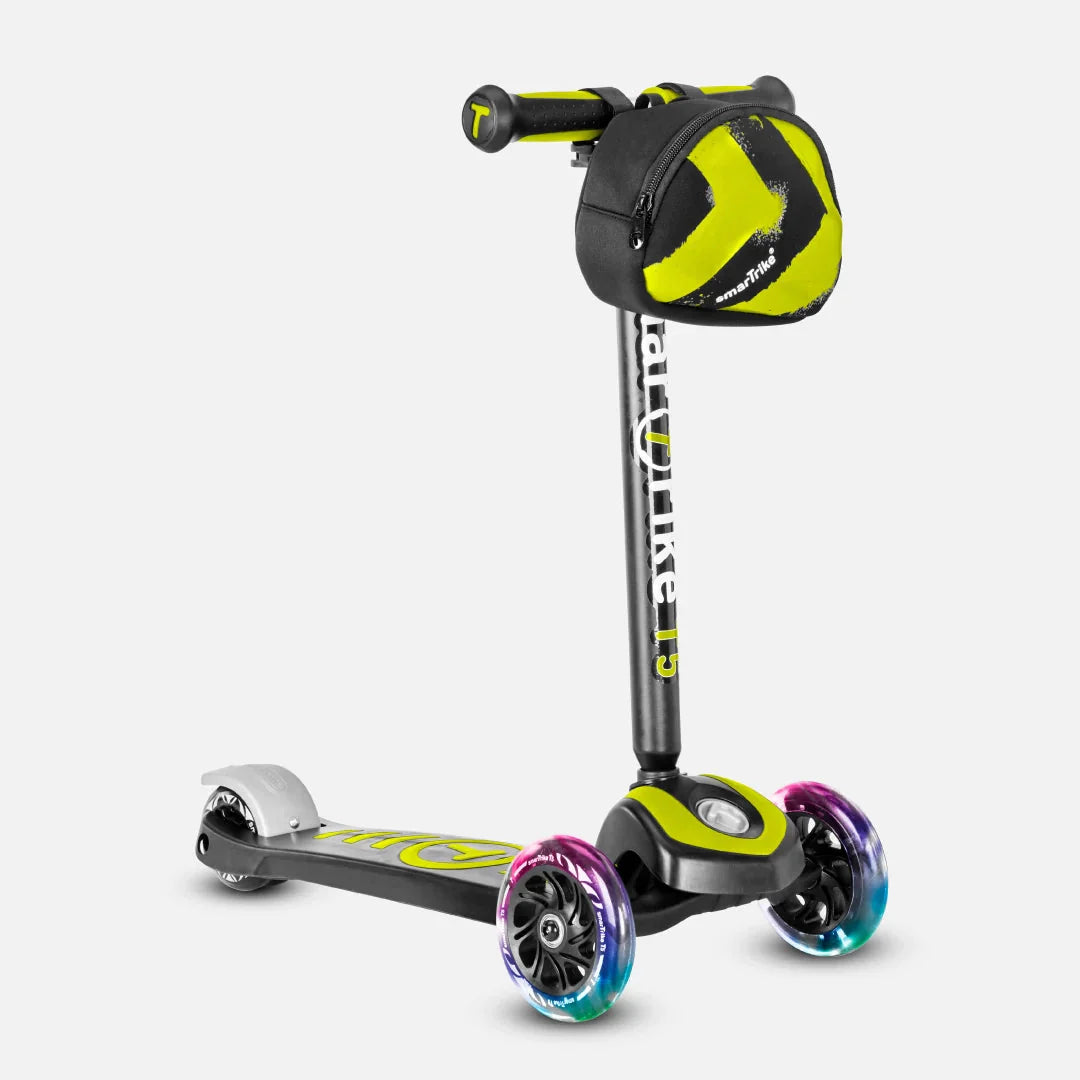 Green and black electric kick scooter with purple-blue glowing wheels and handlebar bag