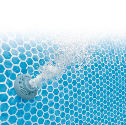 Blue hex-pattern pool bottom with circular return jet and splashing water