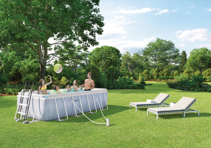 Rectangular above-ground pool with light blue liner and white metal frame outdoors