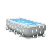 Rectangular above-ground pool with white frame and grey panels, blue water