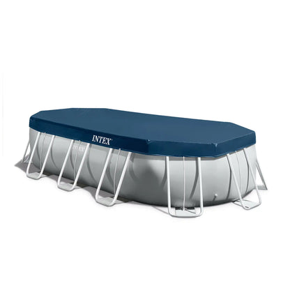 Oval above-ground pool set with navy cover, grey metal frame and arched support legs