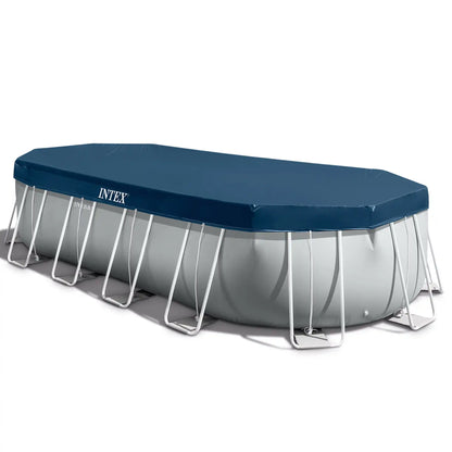 Oval frame above-ground pool with gray base, white legs, and blue cover