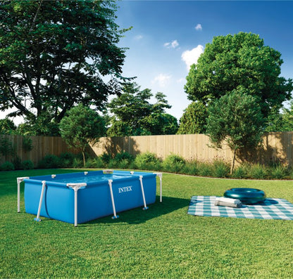 Blue rectangular frame pool with white frame bars and water inside
