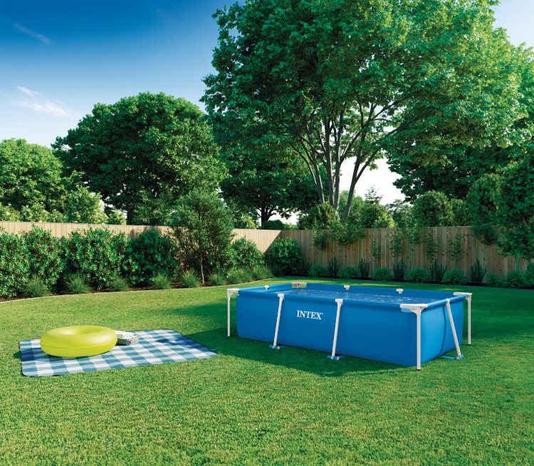 Rectangular frame pool, blue liner with white frame in outdoor yard