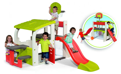 Kids indoor play center with green platform, red slide, and basketball hoop