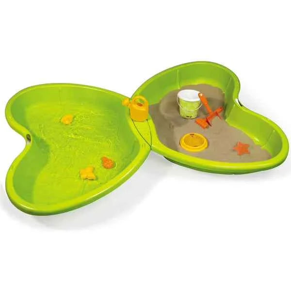 Green butterfly-shaped sand pit with two shallow basins and molded play accessories