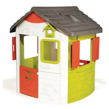 Children's plastic playhouse with gray roof, white walls, lime and red doors and windows
