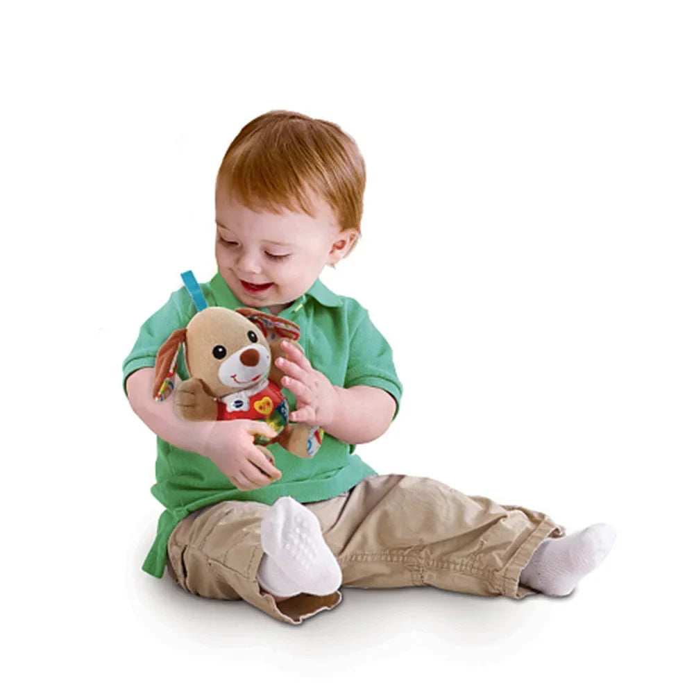 Singing puppy plush toy, beige dog with smiling face and colorful activity buttons