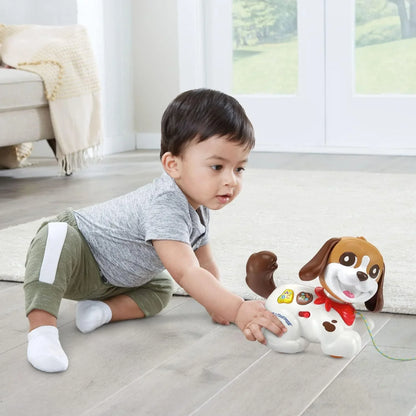 White and brown puppy toy with pull string extended, colorful buttons, red collar