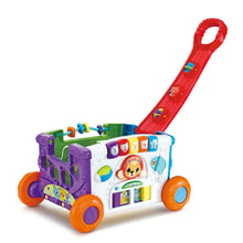 Red pull-along activity wagon with sorting blocks, colorful panels, and orange wheels