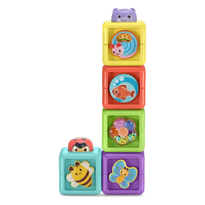 Stacked cube toy blocks with animal faces in purple, teal, yellow, and red