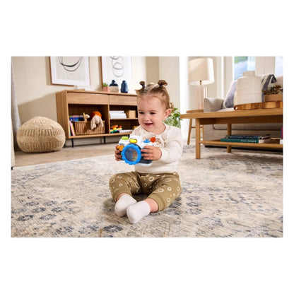 Kids' VTech snap-and-smile camera in blue, held by a smiling child