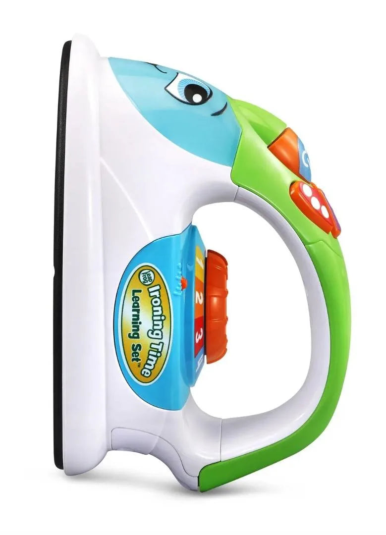 Children’s ironing toy, white body with green trim and circular blue control dial